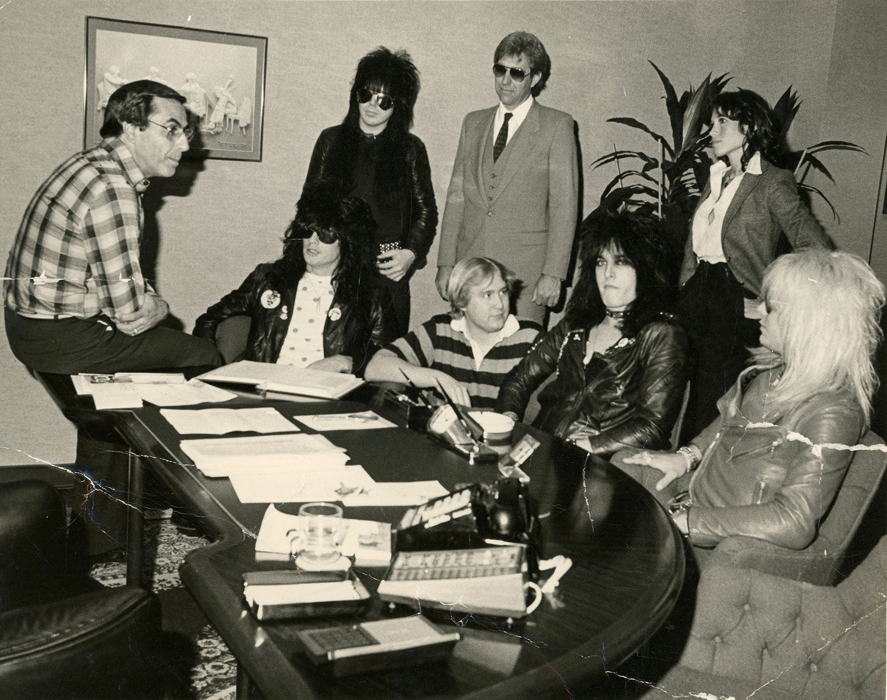 Motley Crue and Elektra Chairman Joe Smith at their major label signing in LA 1982