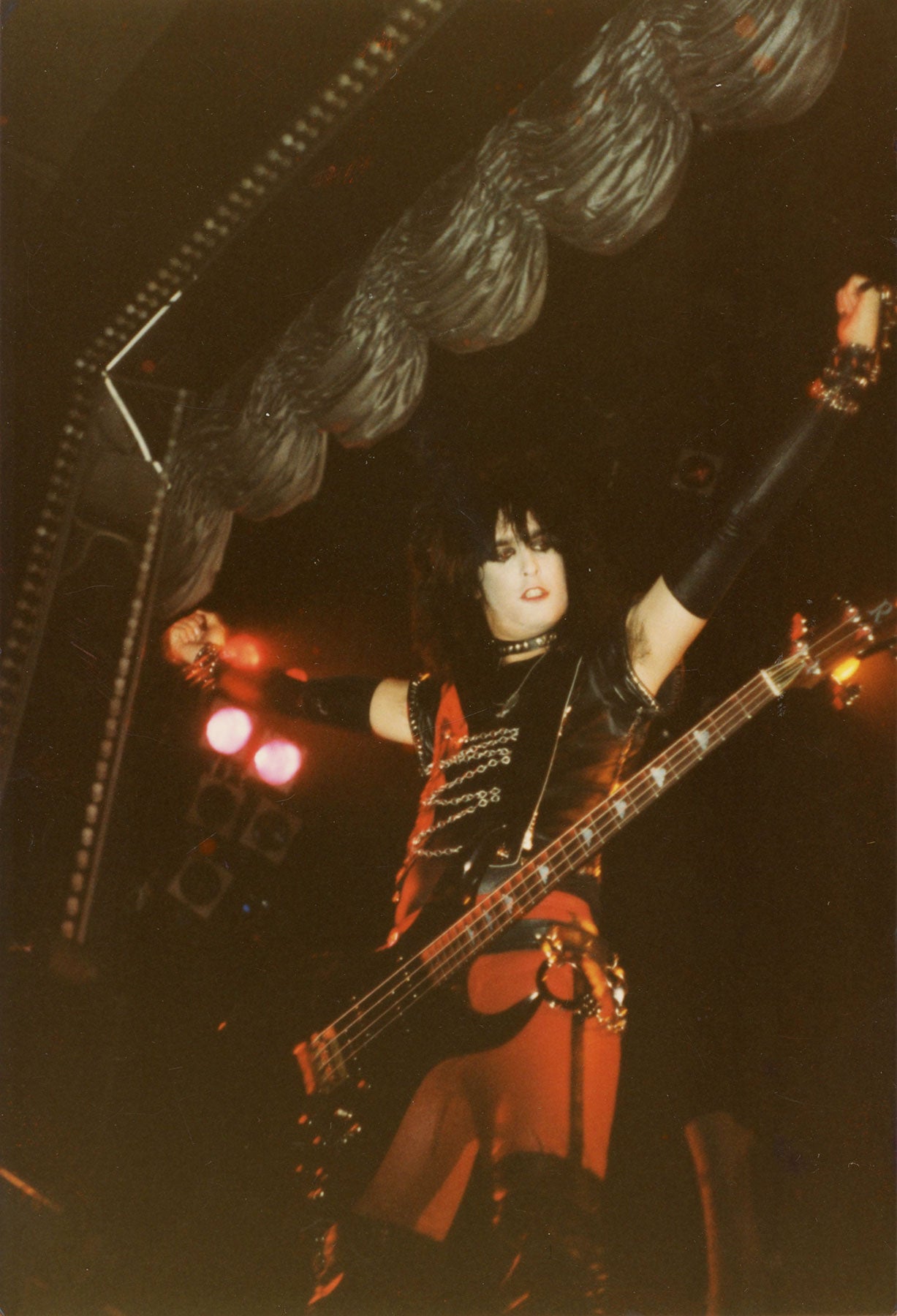 Nikki Sixx blesses the audience during the Shout At The Devil Tour circa 1983
